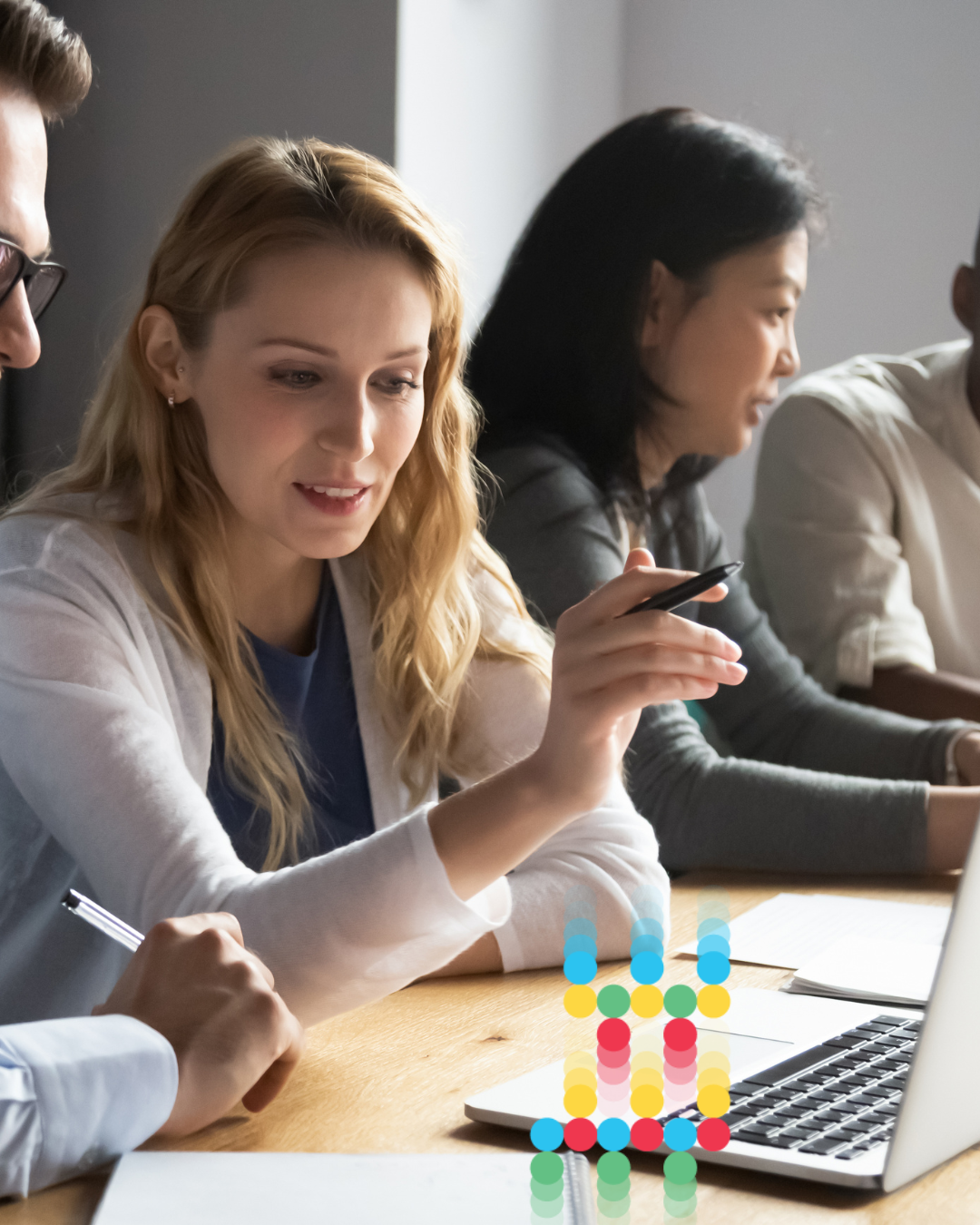 A group of people working together and consuming corporate learning.