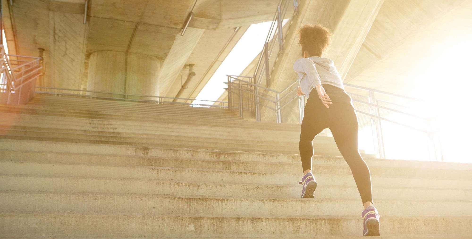 Woman climbing a set of stairs