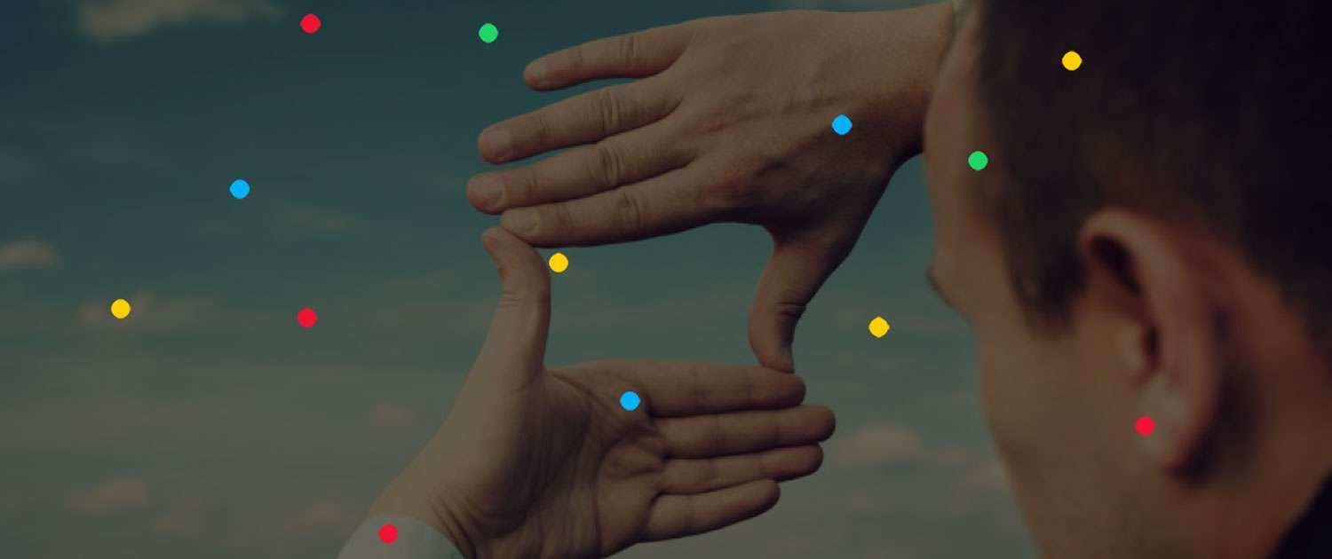 Person holding up hands in a square shape