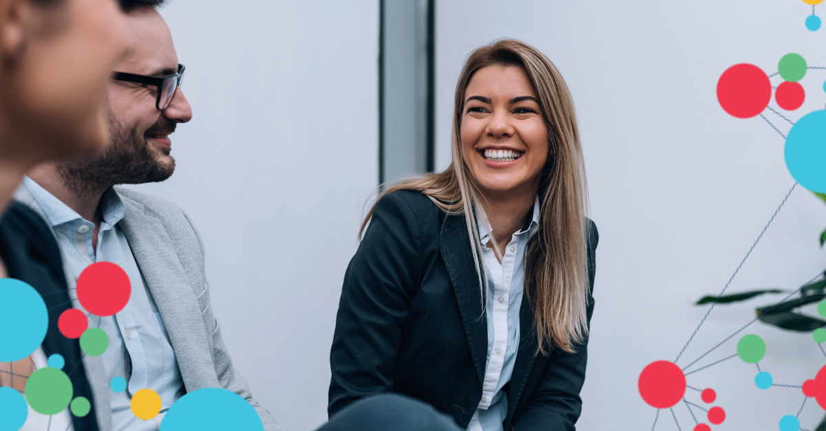 Woman smiling at two team members