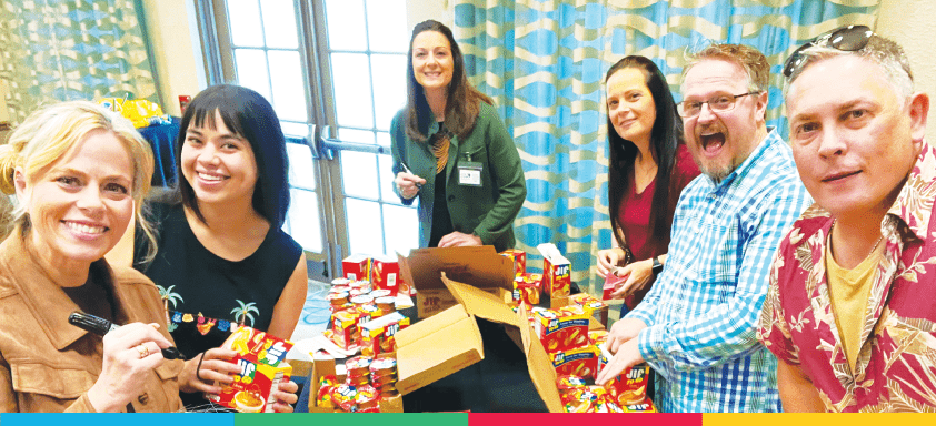 Team members packaging food together