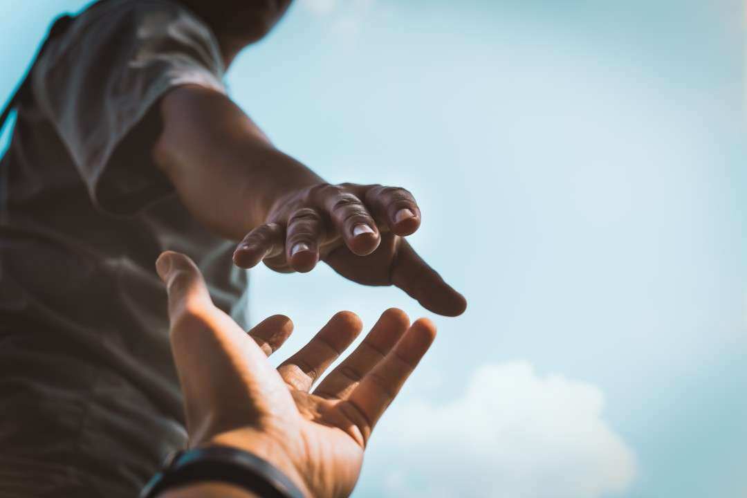 Man reaching for someones hand