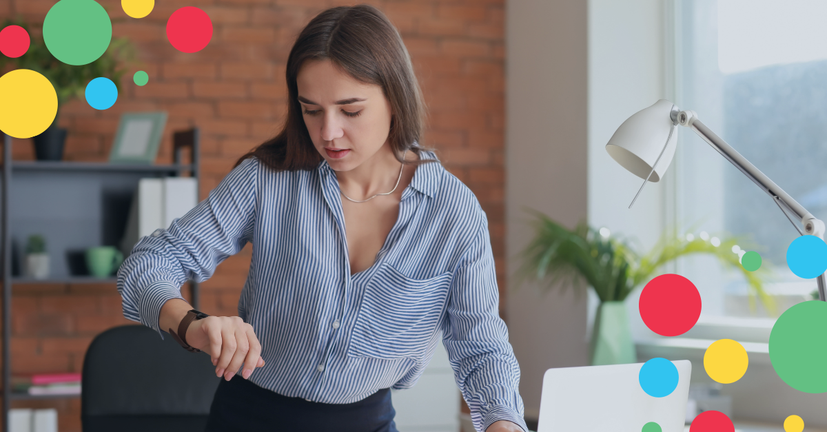 Woman checking her watch while working