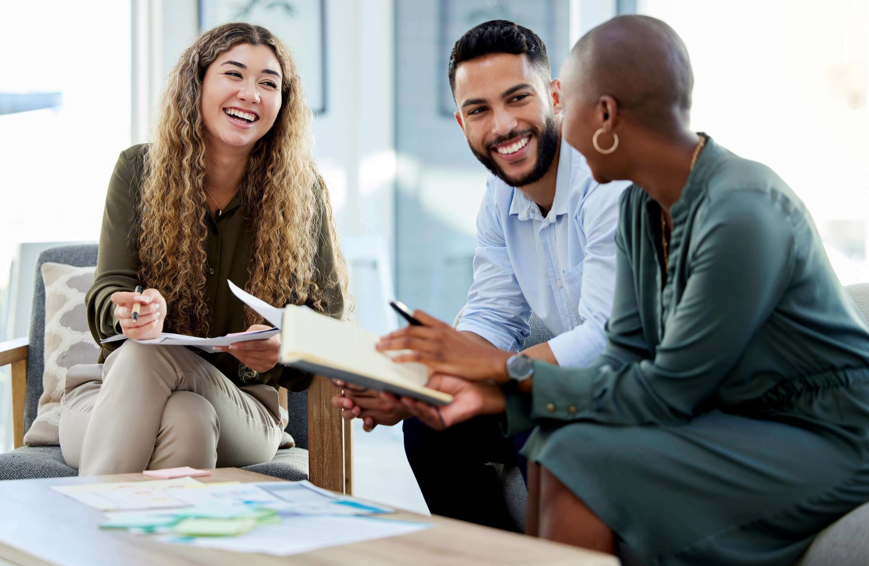 People chatting and laughing in an office