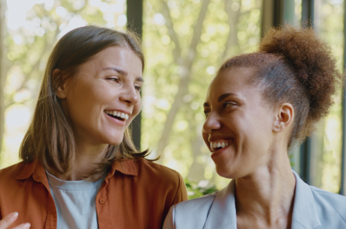 photo of two women laughing